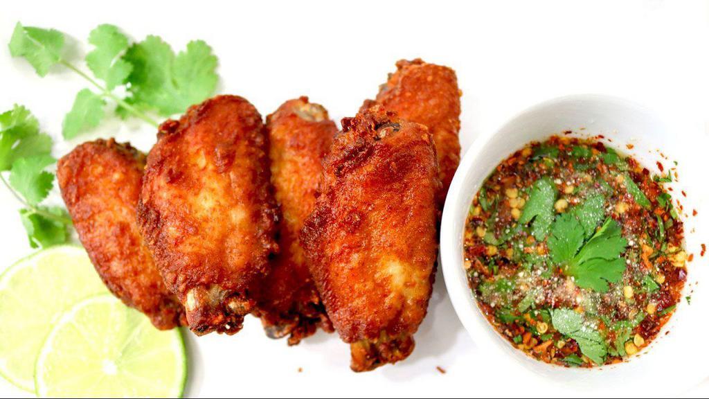 Thal Gai Tod / Chicken Wings · Four pieces of fried chicken wings with our chef special sauce.