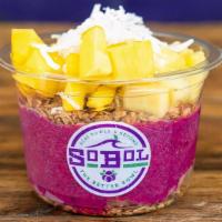 Pitaya Bowl · Pitaya bowl contains granola, pitaya puree and an assortment of mango, kiwi, pineapple, coco...