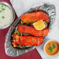Fish Tikka · Salmon lightly seasoned and marinated with yogurt, ginger, garlic, and other spices for 12 h...