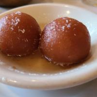Gulab Jamun · Deep fried milk curd balls soaked in sweet syrup.