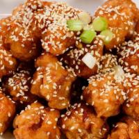 Sesame Chicken · Crispy chunks of boneless chicken sauteed with special roasted Sesame sauce, Served with bro...