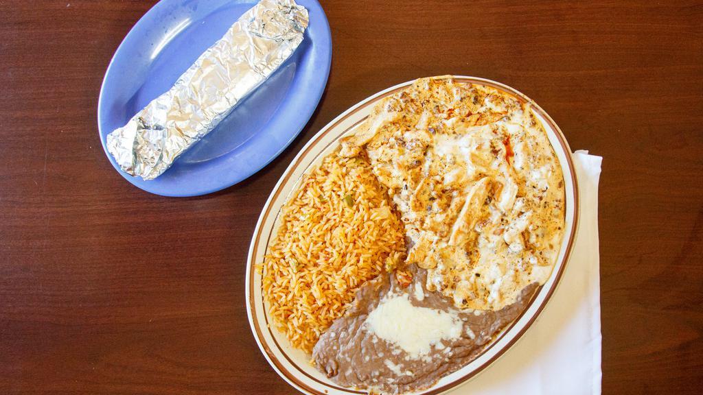 Pollo A La Crema · Served with Spanish rice, refried beans and flour tortillas
