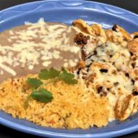 Chorypollo · Grilled chicken and chorizo covered with cheese served with Spanish rice and refried beans.