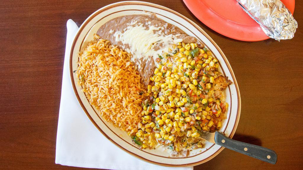 Pollo Campestre · Grilled chicken breast topped with grilled fresh vegetables (tomatoes, onions, bell peppers, cilantro & corn) served with Spanish rice, refried beans and tortillas.