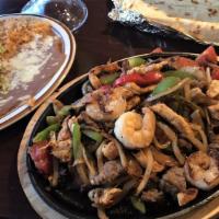 Fajitas Mazatlan · Grilled shrimp, scallops, crab, tilapia fish fillet, mushrooms, onions, bell peppers & tomat...