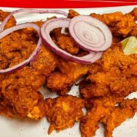 Chicken Pakora · Batter fried chicken fritters mixed with house spices.
