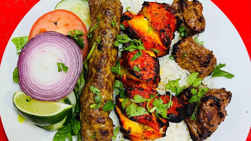 Family Kabob Special · Combination of 3 pieces bonelees chicken, 3 pieces of lamb and 1 skewer of seekh kabob. Served with basmati rice, chickpeas salad and naan.