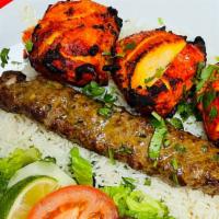 Combo 1 · 3 pieces of bonless chicken and 1 skewer of sheekh kabob. Served with basmati rice, chickpea...