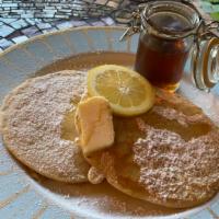 Lemon Pancakes · Two large buttermilk lemon pancakes. Served with butter and syrup. Add extra plain pancake o...