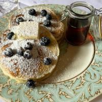 Blueberry Pancakes · Two large buttermilk blueberry pancakes with syrup and butter. Add extra plain pancake or ex...