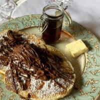 Nutella Pancakes · Two large Nutella buttermilk pancakes with Nutella, butter, and syrup. Add extra plain panca...