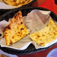 Onion Kulcha · Naan stuffed lightly with spiced onion.