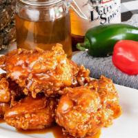 Crispy Chicken Bites · Enhance the flavor by having them tossed, or served to the side, in Lefty's Mild BBQ, Buffal...