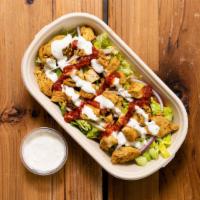 Chicken Shawarma Over Rice · Chicken marinated, thin sliced over spiced basmati rice with tomato and onions. Includes whi...