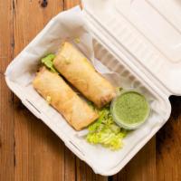 Veggie Spring Rolls · A fried roll with vegetables and spices.