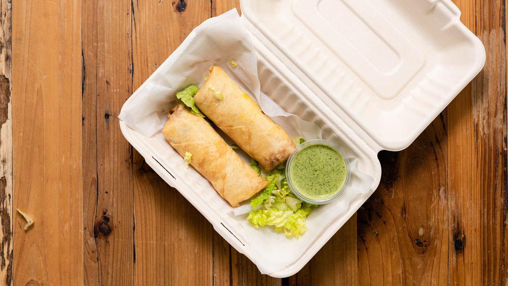 Veggie Spring Rolls · A fried roll with vegetables and spices.