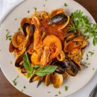 Zuppa Di Pesce · Sautéed shrimp, scallops, calamari, clams, and mussels in marinara or fra Diavolo sauce serv...