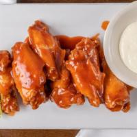Buffalo Wings Catering · Chicken wings are breaded and fried, then tossed in buffalo sauce. Supersized to your party.