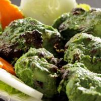 Hariyali Chicken Kabab · Classic north Indian starter where chicken is flavored with fresh green herbs - mint and cor...