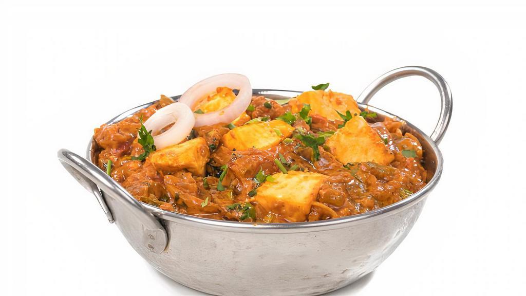 Kadai Paneer  · Homemade cottage cheese with bell pepper, green chili and spring onion.