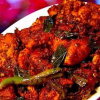 Hyderabadi Chicken Curry · Chicken cooked in traditional Hyderabadi style with homemade spices.
