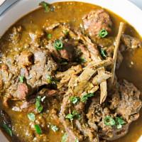 Goat Curry · Goat cooked in traditional Andhra style with homemade spices.