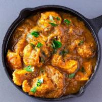 Chicken Vindaloo · Seasoned chicken cooked in rich spicy tangy gravy with potatoes, coconut and curry leaves.