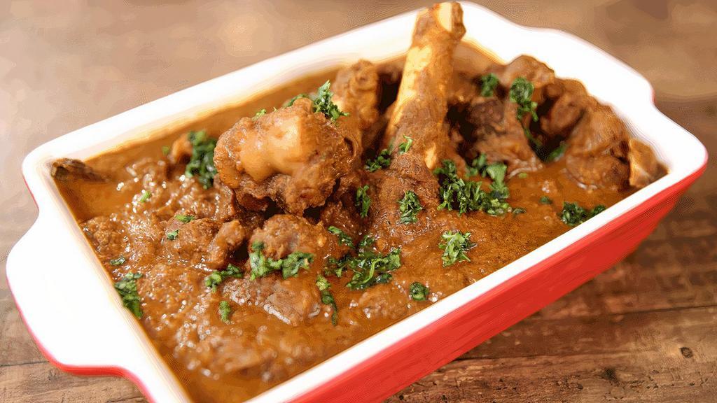 Goat Chettinad · Goat made with roasted ground exotic spices peppercorn, star anise and coconut.