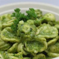 Pasta With Pesto · Pasta with homemade arugula and basil pesto, topped with parmesan cheese.