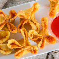 Krab Rangoon (6 Pcs.) · Crab and cream cheese filled wontons fried until golden brown.