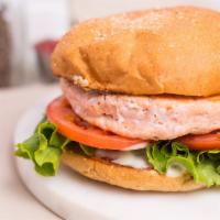 Salmon Burger · Grilled salmon patty, cusabi dressing, lettuce, tomato, toasted VBC wheat bun.