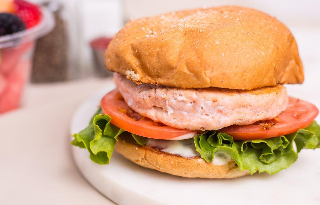 Salmon Burger · Grilled salmon patty, cusabi dressing, lettuce, tomato, toasted VBC wheat bun.
