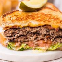 Patty Melt · Single patty, toasted rye bread, Swiss cheese, grilled onions.