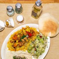 Chicken Shawarma Plate · Chicken shawarma accompanied with three sides of saffron rice, hummus, and middle Eastern sa...