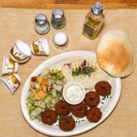 Falafel Plate · Seven fresh deep fried falafels with middle Eastern salad, hummus, tahini sauce, and pita br...