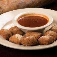 Toasted Ravioli · Choice of meat, cheese or a combination served with Maggie's Sugo