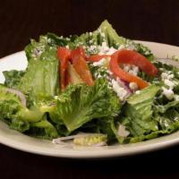 Santa Teresa Salad · Romaine lettuce, red onions, and goat cheese, tossed with a dijon vinaigrette and topped wit...