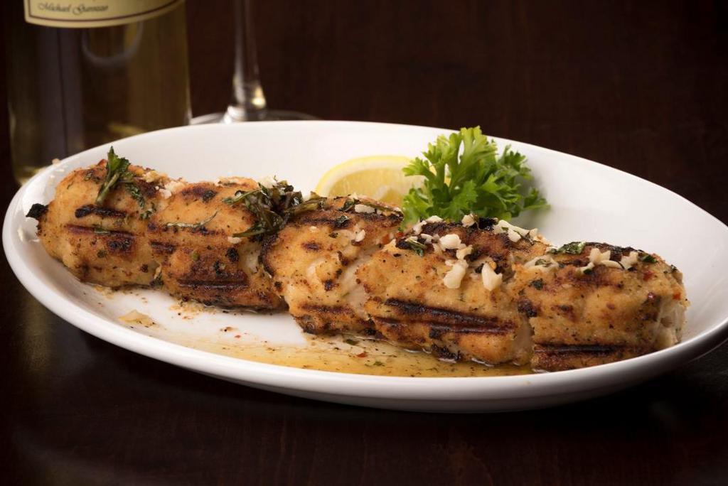 Garozzo · Marinated chicken breast rolled in Italian bread crumbs skewered broiled.  Served in amogio, a blend of olive oil, garlic, lemon juice and herbs