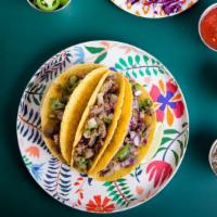 Chicharron Prensado Tacos (2) · A must try!!! Fatty, pork carnitas and crunchy pork skin with guajillo chiles. Served on you...