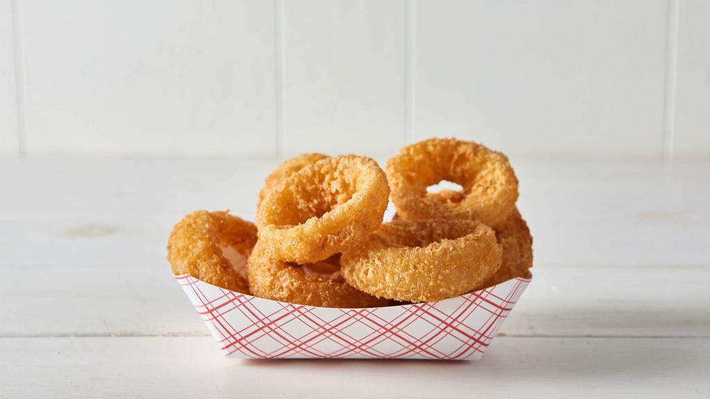 Onion Rings · Thick cut, battered onion rings fried to crispy, golden perfection.