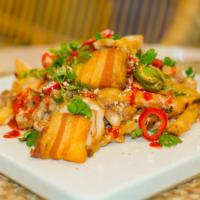 Hot Mess Nacho Fries · Gluten free. Pork belly carnitas, melted queso, pickled chile, pinto bean, pico, cotija, and...