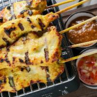 Chicken Satay · Gluten free. Grilled slices of marinated chicken on skewers, coconut milk served with peanut...