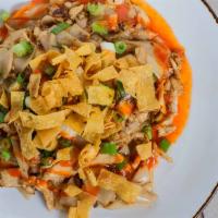 Street Chicken Noodle · Stir-fried noodle with chicken, egg, scallion and crispy skin wonton and sriracha sauce on t...