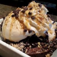 Botticelli Brownie Sundae · Our famous chewy chocolaty fudge brownie is topped with Honey Vanilla ice
cream, and smother...