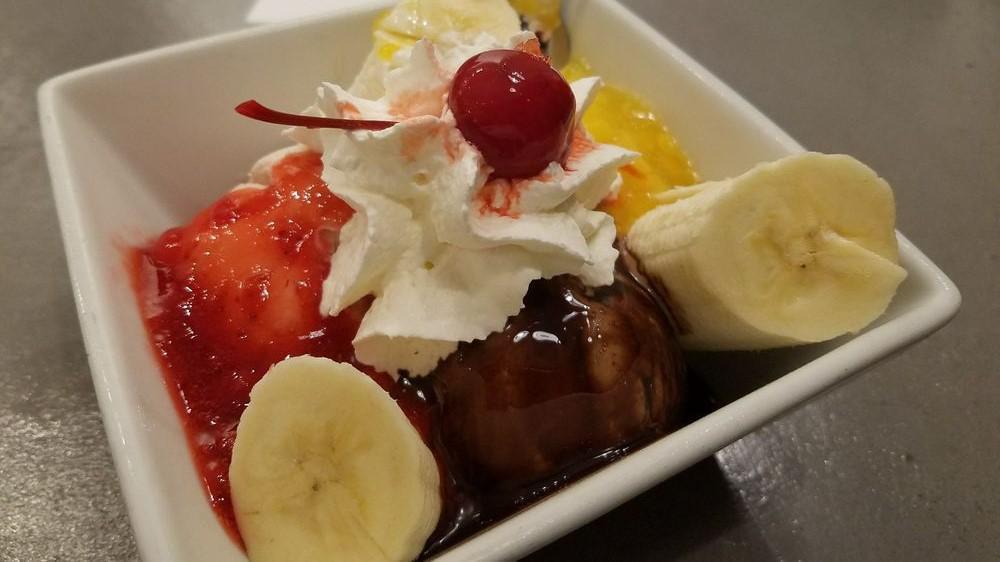 The Bellini Banana Split · Strawberries n’ cream, honey vanilla and old fashioned milk
Chocolate ice creams cradled with a banana. Adorned with strawberry,
Mango, and chocolate sauces beneath whipped cream, nuts, and a
Cherry. a renaissance for the ages.