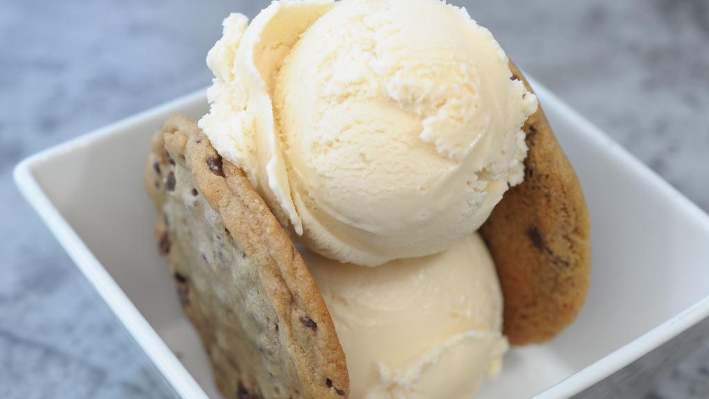 Not So Leaning Tower Of Pisa · No need to travel all the way to Italy to see this masterpiece. The large: Two
scoops “Sandwiched” between delicious chocolate chip cookies. The small: one cookie
sandwiched between two small scoops of Honey Vanilla.