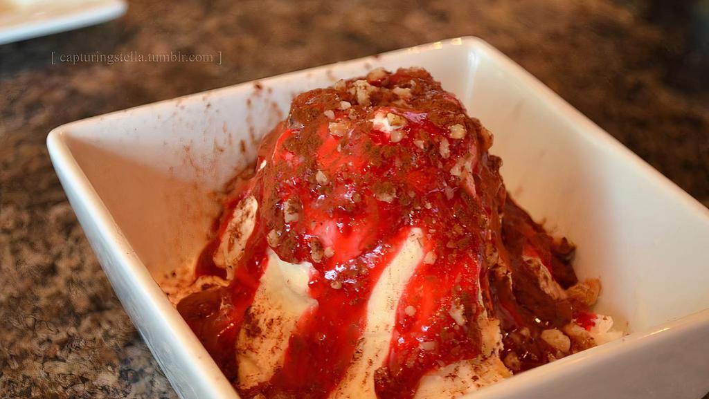 St. Helens · Massive boulders (walnuts) lie at the base of a Honey Vanilla ice
 cream peak that is dusted with volcanic ash (cocoa) and
erupting with molten lava (raspberry sauce).