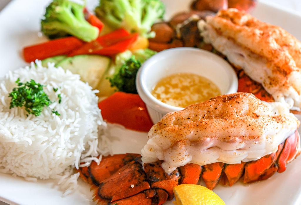 Twin Lobster Tails · Old Bay Butter Sauce Served with Rice & Veggies