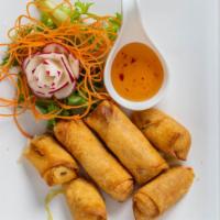 Thai Ping Spring Roll (4 Pieces) · Crispy roll of seasoned vermicelli, carrots, cabbage serve with tasty plum sauce.