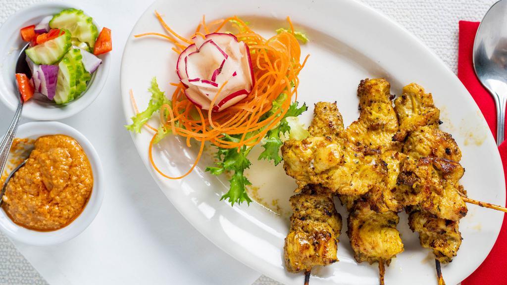 Satay 4 Skewers · Chicken, beef, or pork marinated with Thai herbs on skewers. Serve with cucumber salad and peanut sauce on the side.